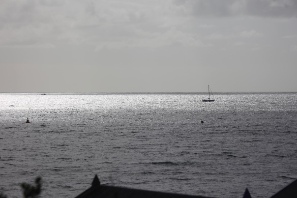 Yacht on sunlit sea
